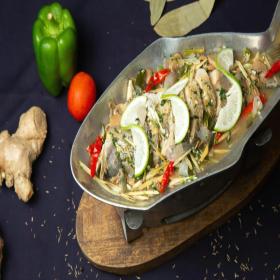 Pizza dough being stretched by hand